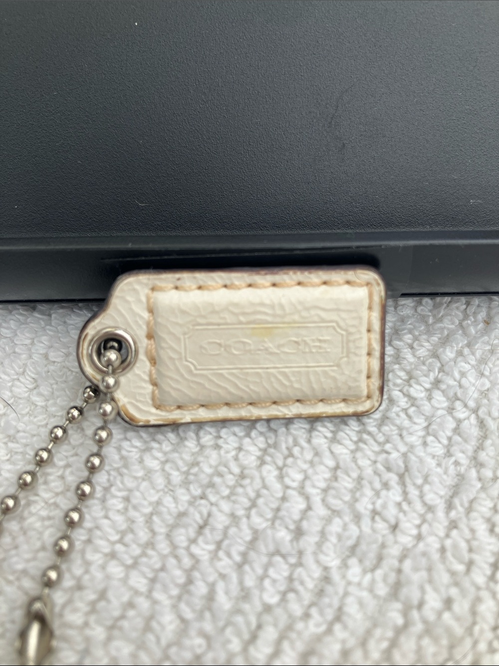 Coach small 1” cream leather hang tag with stitching